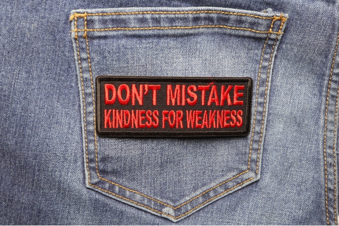 Don't Mistake Kindness for Weakness Patch shown on jeans