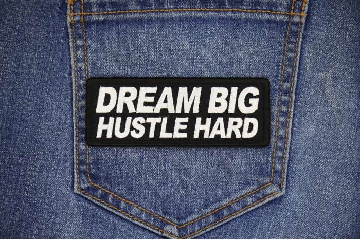 Dream Big Hustle Hard Patch shown on jeans
