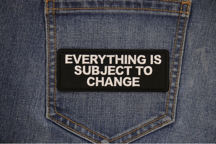 Everything is Subject to Change Patch shown on jeans