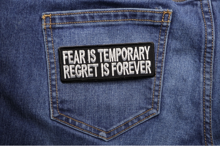 Fear Is Temporary Regret Is Forever Patch shown on jeans