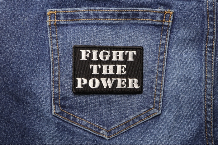 Fight The Power Iron on Morale Patch shown on jeans