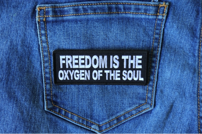 Freedom is the Oxygen of the Soul Iron on Morale Patch shown on jeans