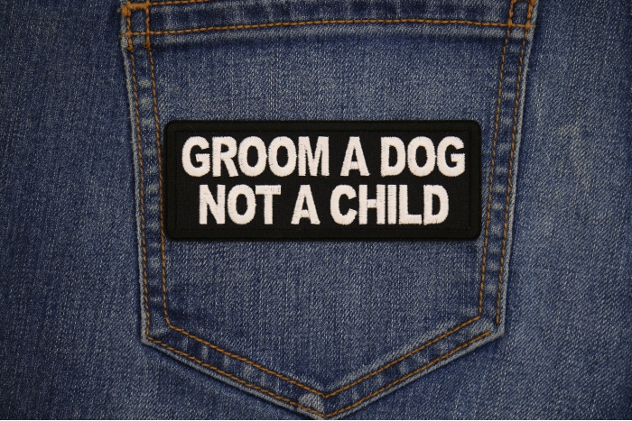 Groom a Dog Not a Child Patch shown on jeans