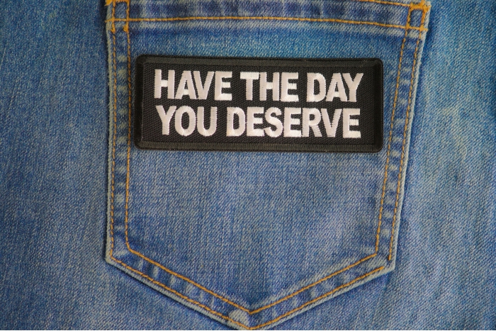 Have The Day You Deserve Patch shown on jeans