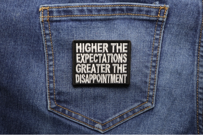 Higher Expectations Greater the Disappointment Patch shown on jeans