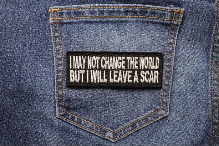 I May Not Change The World But Will Leave A Scar Iron on Morale Patch shown on jeans