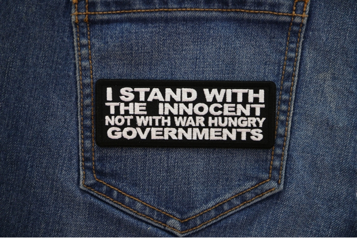 I Stand with the innocent Not with a war hungry Governments Patch shown on jeans