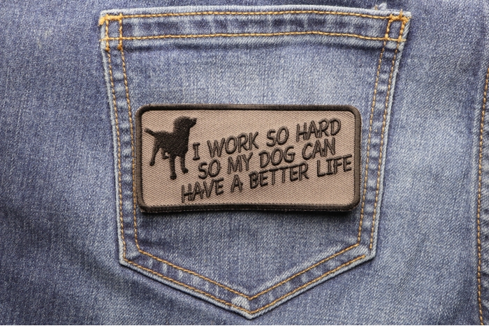 I Work So Hard So My Dog Can Have A Better Life Iron on Funny Patch shown on jeans