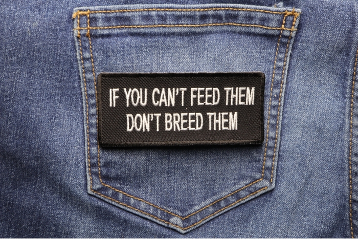 If You Can't Feed Them Don't Breed Them Iron on Morale Patch shown on jeans