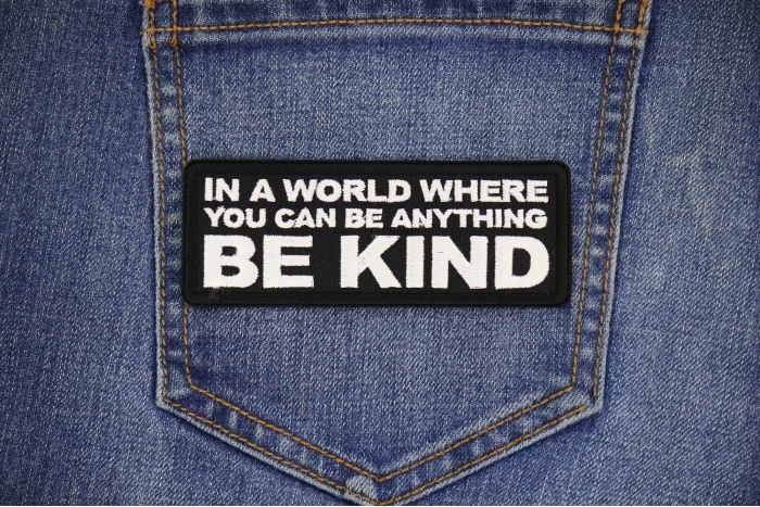In a World Where you can be Anything Be Kind Patch shown on jeans