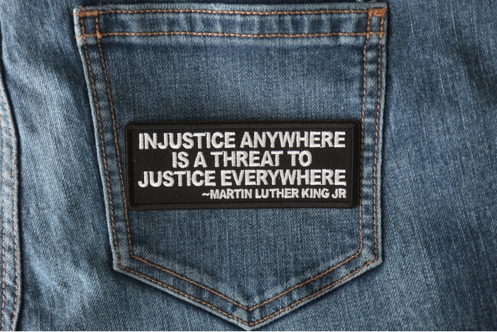 Injustice anywhere is a threat to Justice Everywhere MLK Jr Patch shown on jeans