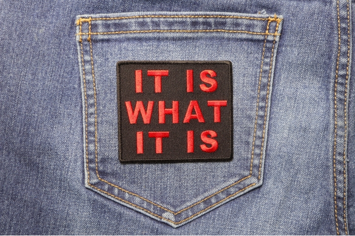 It Is What It Is Iron on Morale Patch In Red shown on jeans