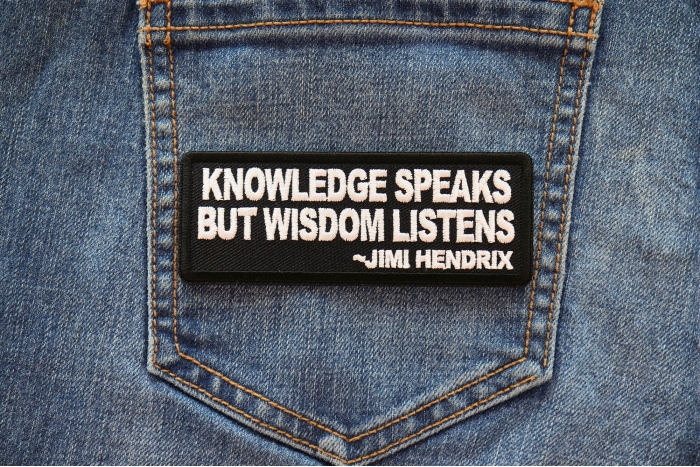 Knowledge Speaks But Wisdom Listens Patch shown on jeans