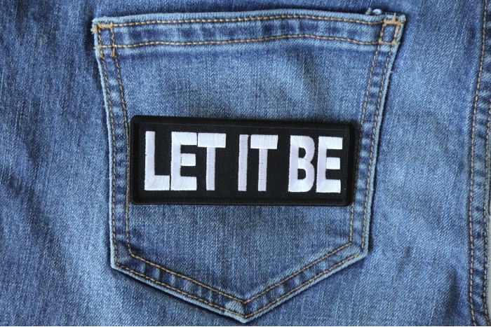 Let It Be Patch shown on jeans