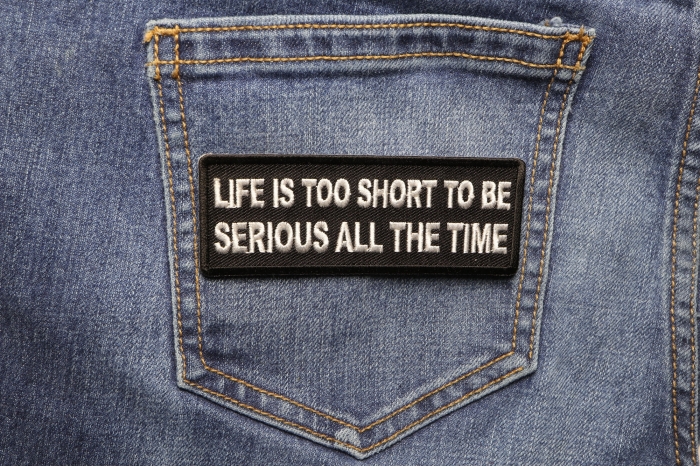 Life is Too Short To Be Serious All The Time Iron on Morale Patch shown on jeans