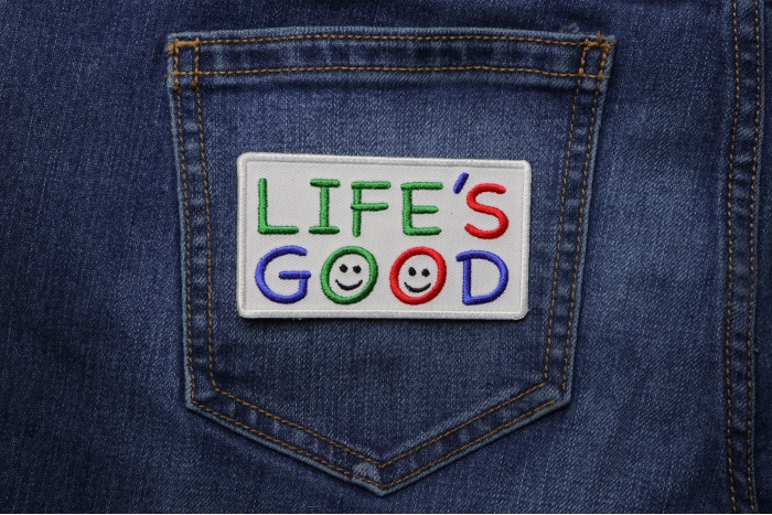Life's Good White Green Red Blue Patch shown on jeans