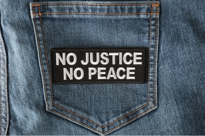 No Justice No Peace Patch shown on jeans