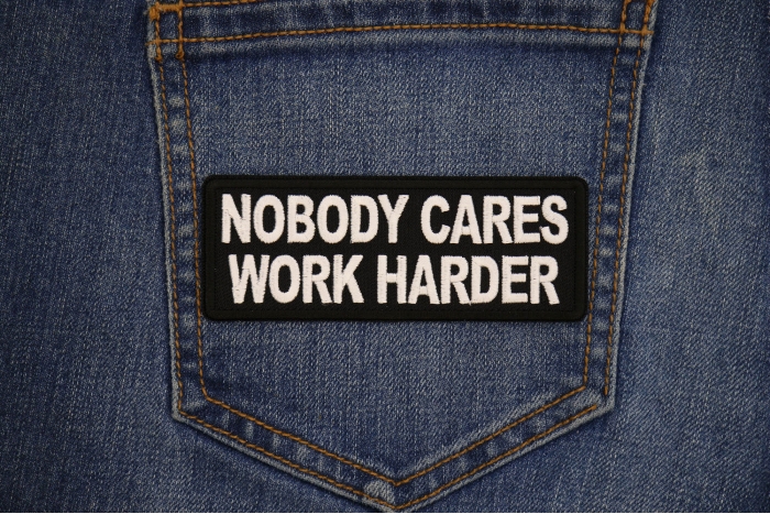 Nobody Cares Work Harder Patch shown on jeans