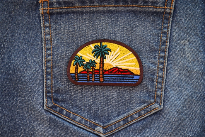 Palms and Sunset Iron on Patch shown on jeans
