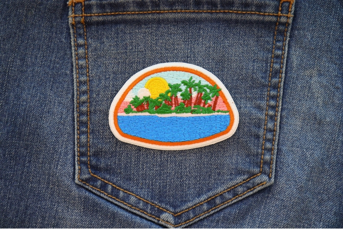 Paradise Island Iron on Patch shown on jeans