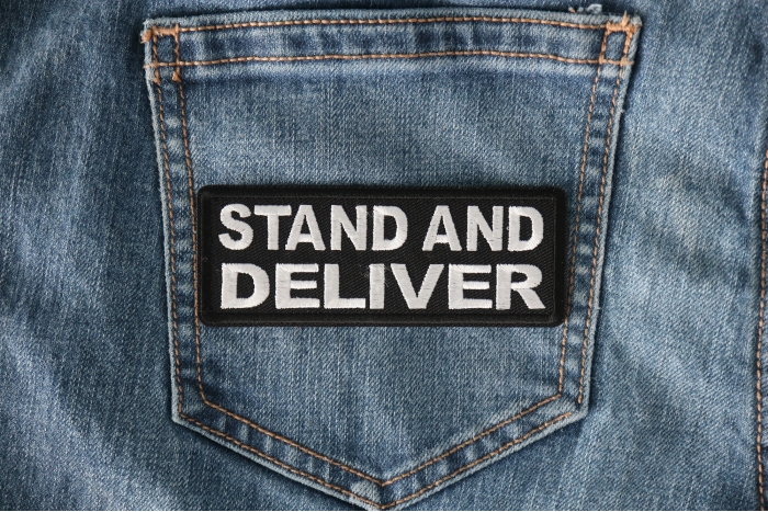 Stand and Deliver Patch shown on jeans