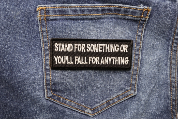 Stand For Something or You'll Fall For Anything Iron on Morale Patch shown on jeans