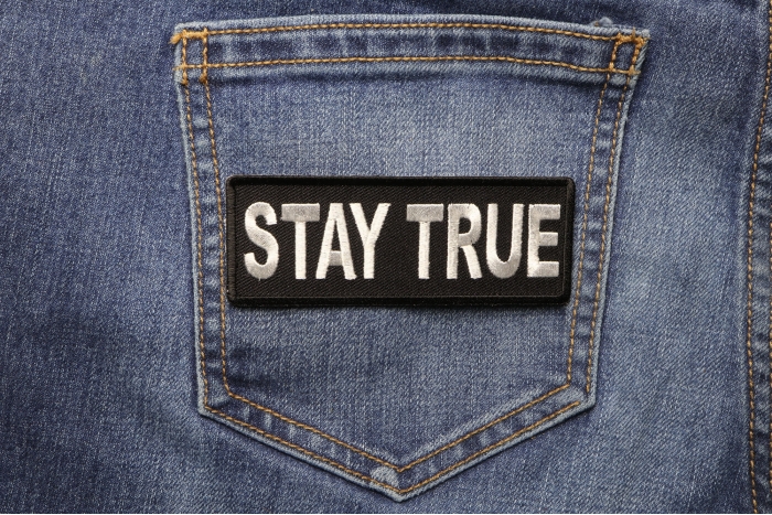 Stay True Iron on Morale Patch shown on jeans