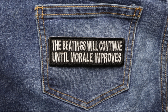The Beatings Will Continue Until Morale Improves Patch shown on jeans