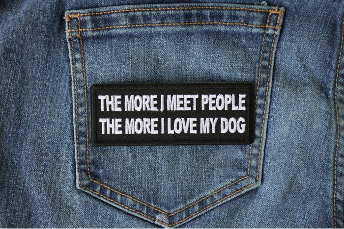 The More I meet People The More I love My Dog shown on jeans
