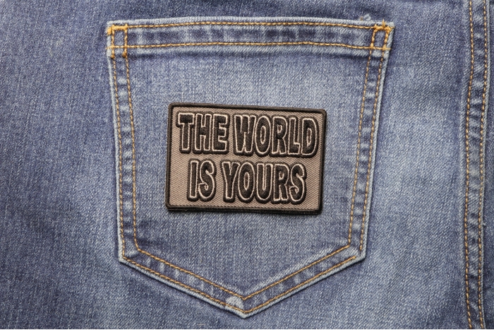The World Is Yours Patch shown on jeans