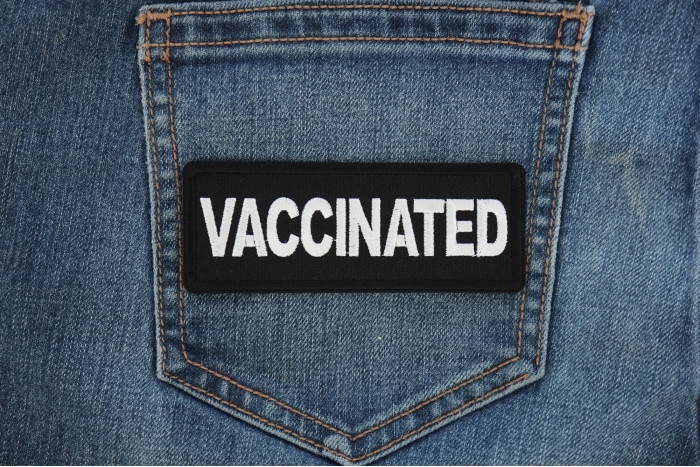 Vaccinated Patch shown on jeans