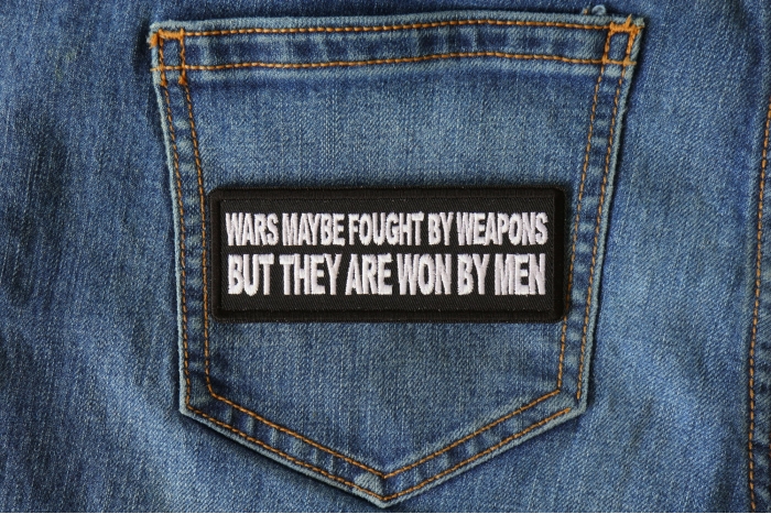 Wars Maybe fought by weapons but they are won my Men Iron on Morale Patch shown on jeans