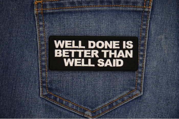 Well Done is Better Than Well Said Patch shown on jeans