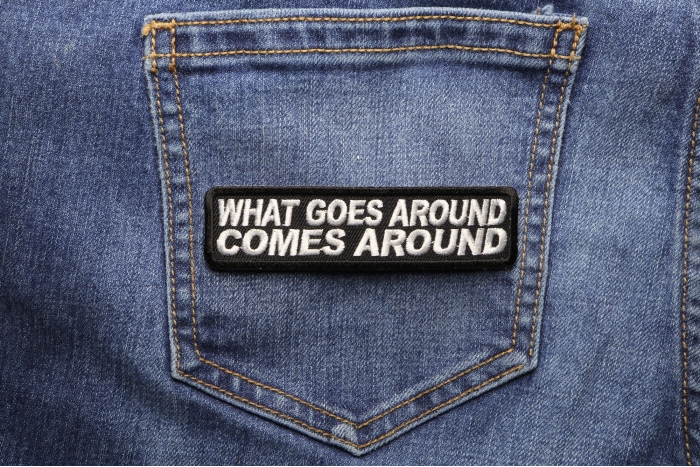 What Goes Around Comes Around Iron on Saying Iron on Patch shown on jeans