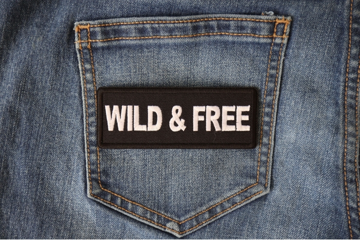 Wild and Free Iron on Morale Patch shown on jeans