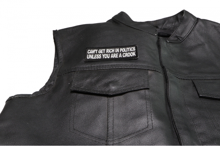 Can't Get Rich in Politics Unless You are a Crook Patch - 4x1.5 inch. Embroidered Iron on Patch shown on leather vest
