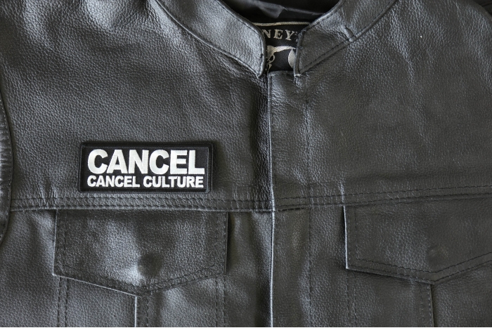 Cancel cancel Culture Patch - 4x1.5 inch - Embroidered Iron on Patch shown on leather vest