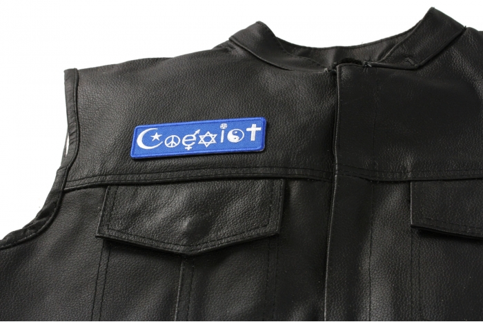 Coexist Patch - 4x1.25 inch. Embroidered Iron on Patch shown on leather vest