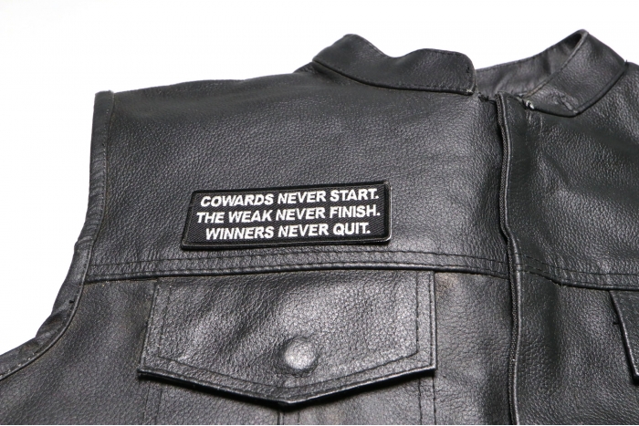 Cowards Never Start. TheWeak Never Finish. Winners Never Quit. Patch - 4x1.5 inch. Embroidered Iron on Patch shown on leather vest