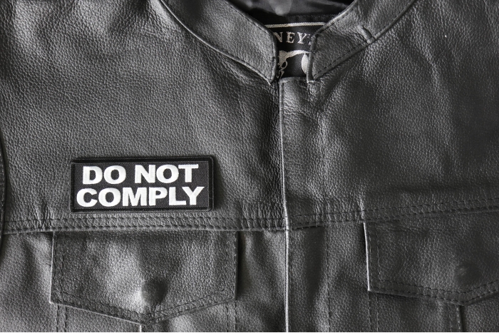 Do not Comply Patch - 4x1.5 inch - Embroidered Iron on Patch shown on leather vest