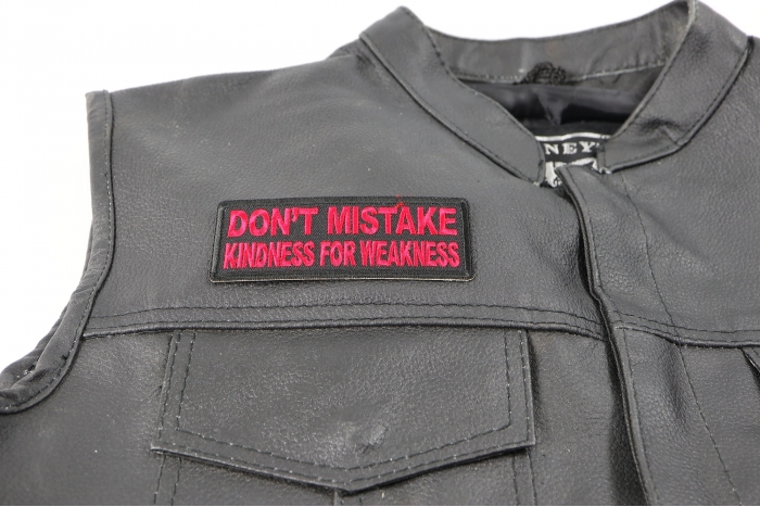 Don't Mistake Kindness for Weakness Patch, Biker Sayings shown on leather vest