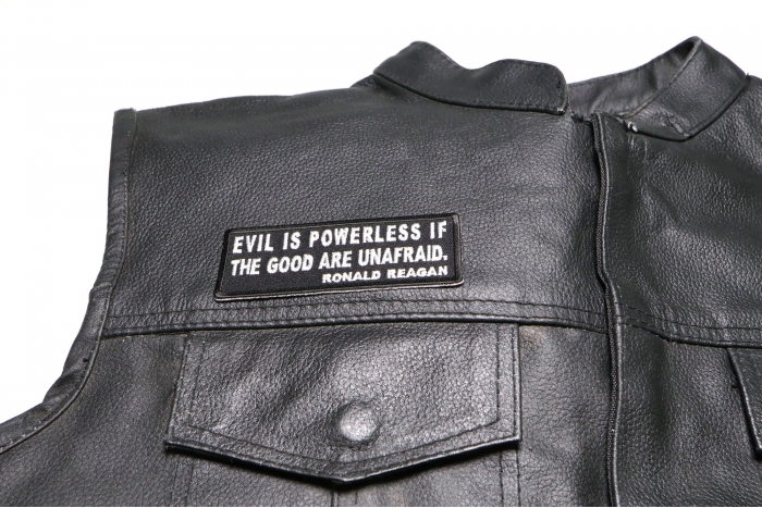 Evil is Powerless if The Good are Unafraid Patch - by Ivamis Trading - 4x1.5 inch - Embroidered Iron on Patch shown on leather vest