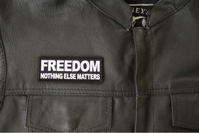 Freedom Nothing Else Matters Patch - 4x1.5 inch - Embroidered Iron on Patch shown on leather vest