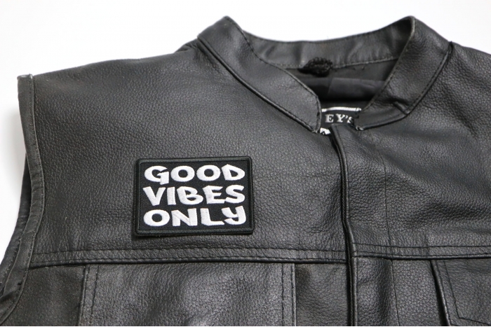 Good Vibes Only Patch - 3x2 inch. Embroidered Iron on Patch shown on leather vest