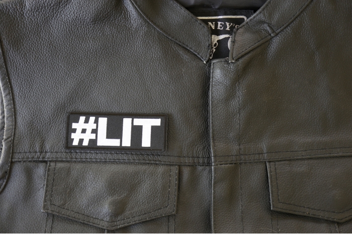 Hashtag LIT Patch - 4x1.5 inch - Embroidered Iron on Patch shown on leather vest