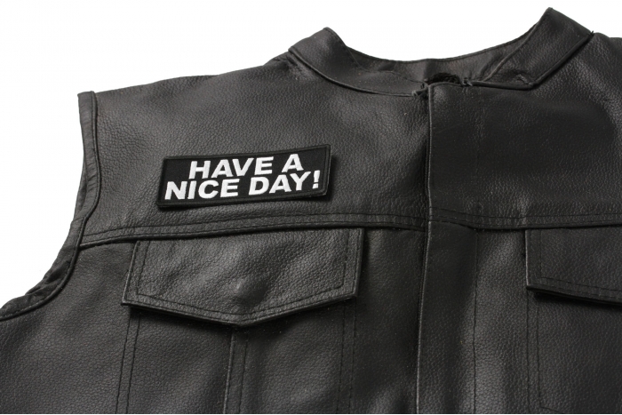 Have A Nice Day Patch - Iron on Patch - 4x1.5 inch shown on leather vest