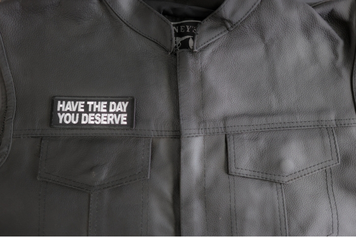 Have The Day You Deserve Patch shown on leather vest