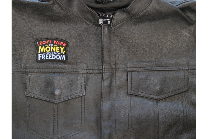 I don't work for Money I work for freedom Patch shown on leather vest