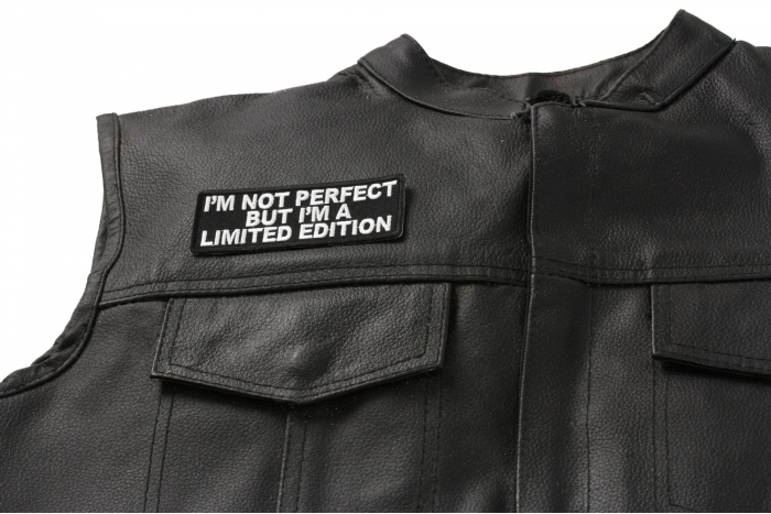I'm Not Perfect But I'm A Limited Edition Patch - 4x1.5 inch. Embroidered Iron on Patch shown on leather vest