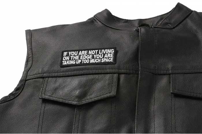 If You Are Not Living On The Edge You Are Taking Up Too Much Space Patch - 4x1.5 inch. Embroidered Iron on Patch shown on leather vest